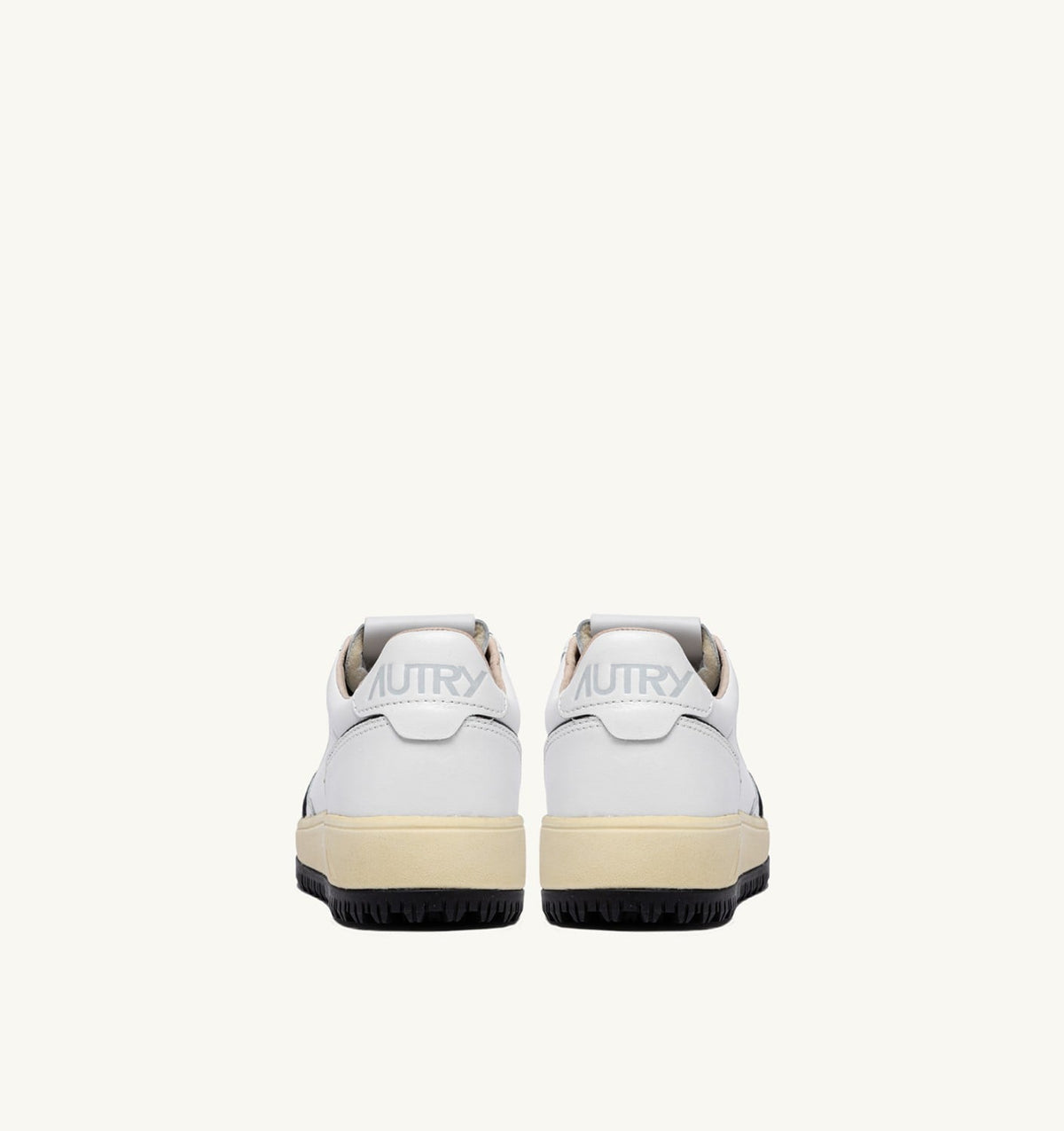 AUTRY Woman GOLF LOW SNEAKERS IN WHITE AND BLACK LEATHER